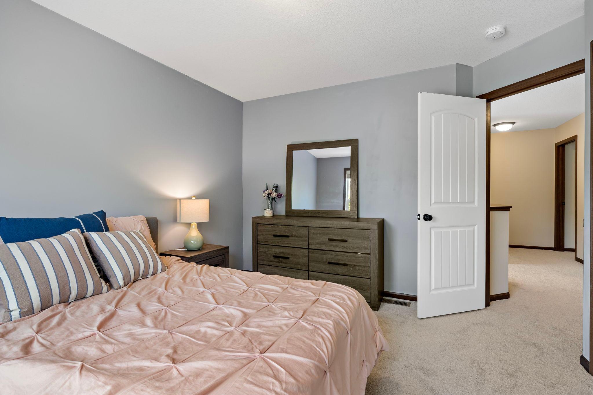 Spacious bedroom with a walk in closet and en suite bathroom