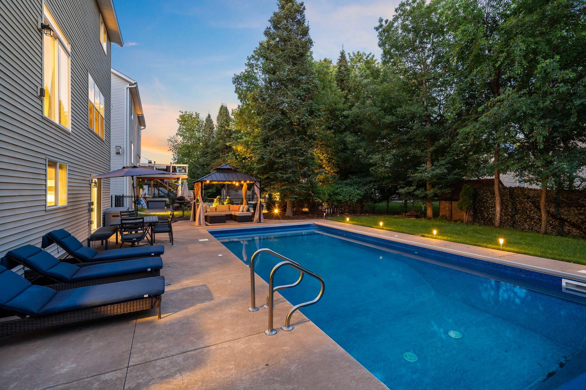 Backyard oasis complete with a saltwater pool and automatic cover for safety feature
