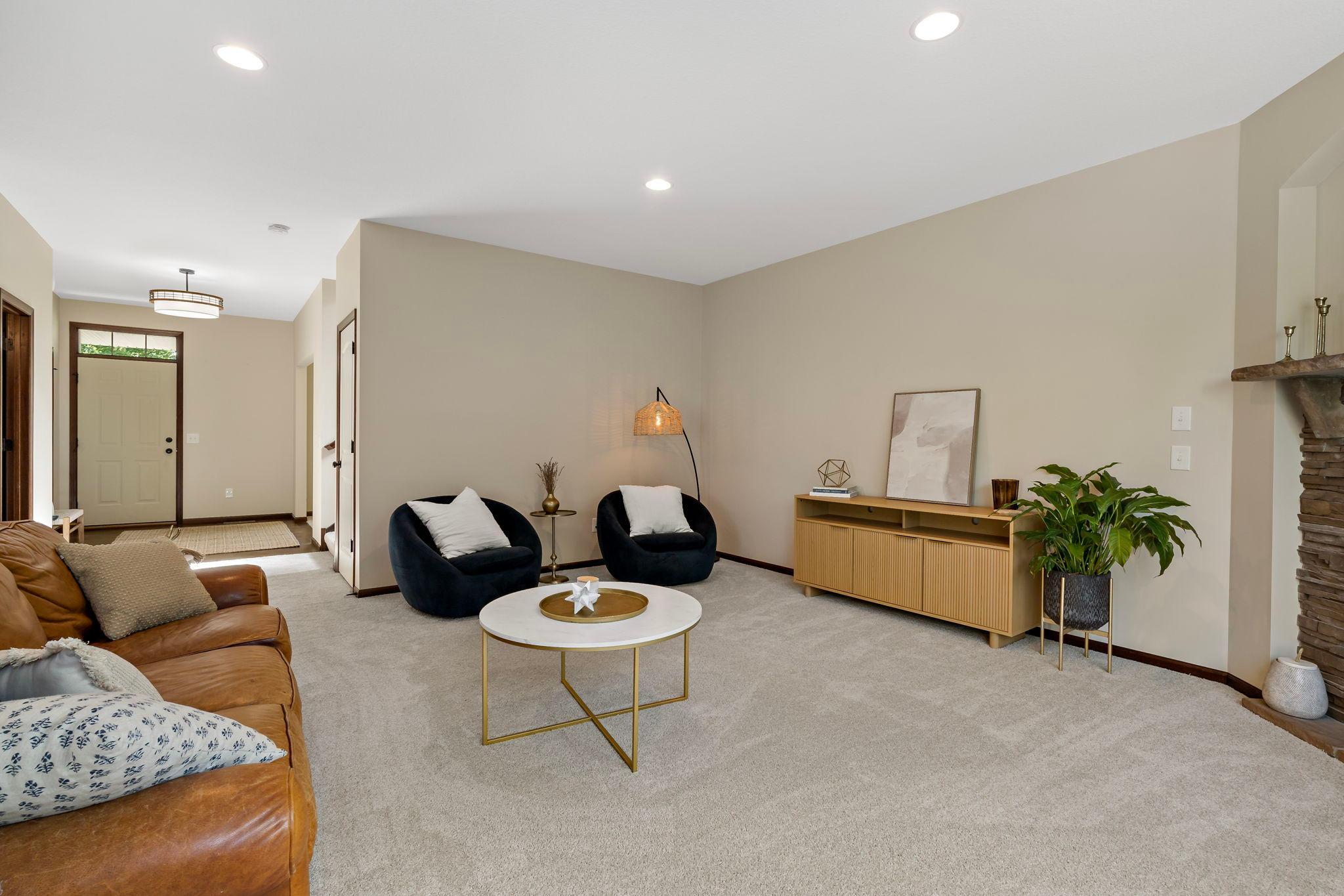 This home is freshly painted with new carpet throughout main and upper level