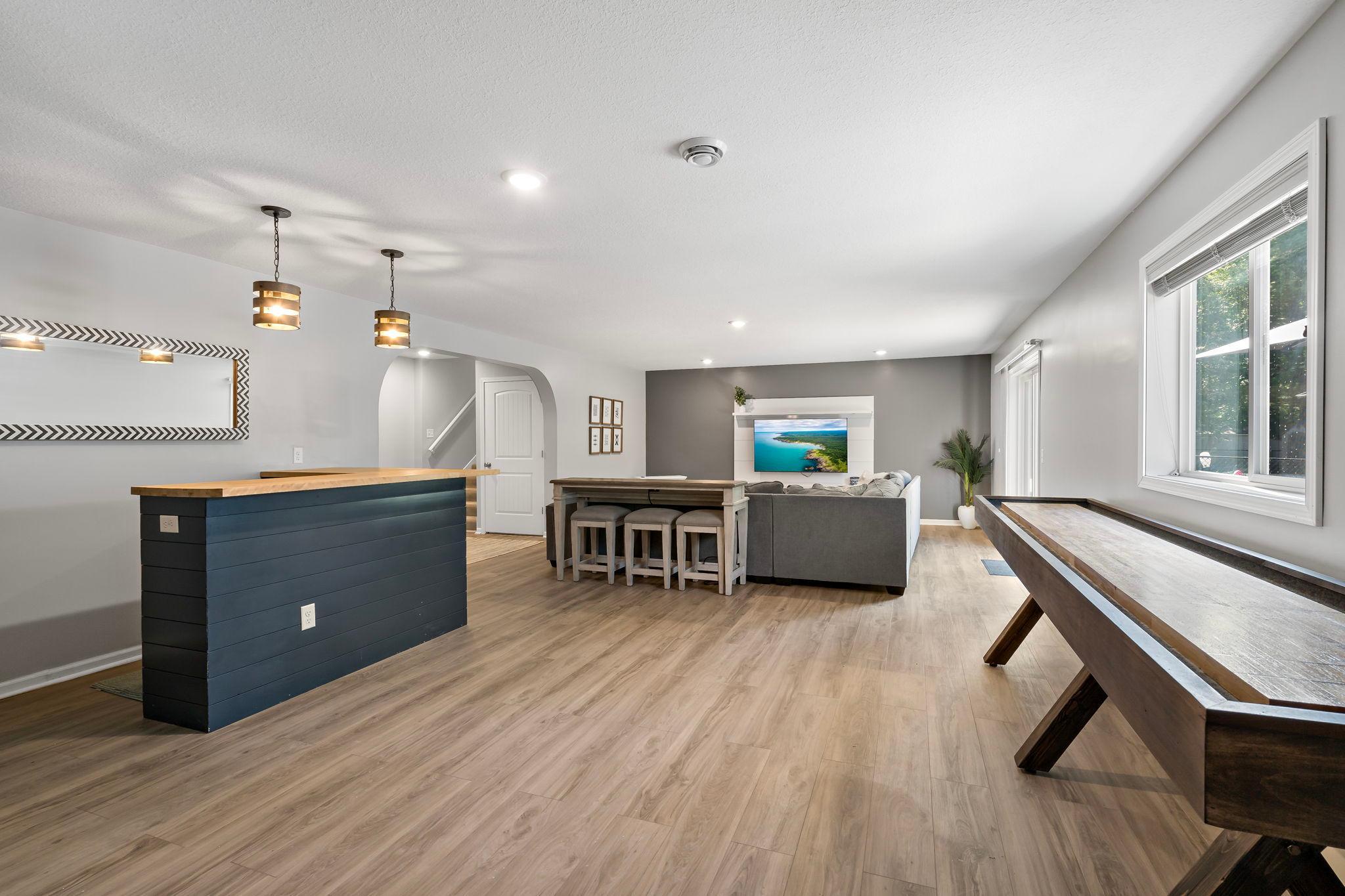 Walkout lower level complete with bar, gaming area and perfect for entertaining