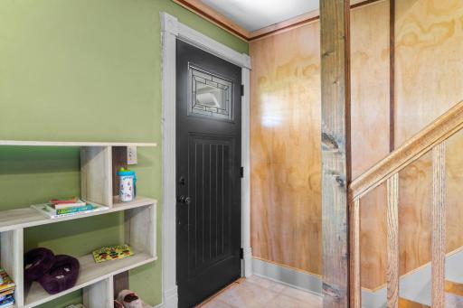 Walking into the home you are welcomed by the living room and staircase to the upstairs.