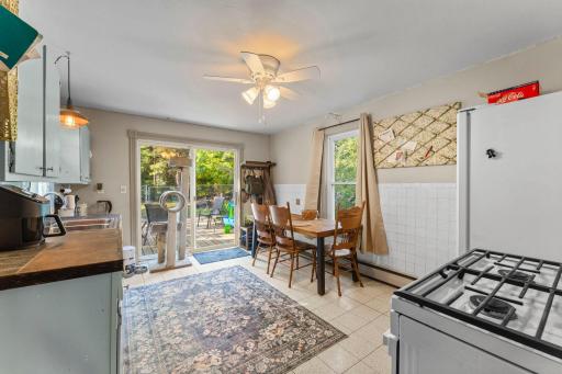 The kitchen has plenty of room and you enter the deck from the sliding glass door.