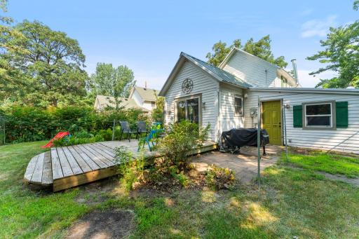 The green door in the photo brings you into the utility room, maybe to wash up after tending the gardens.