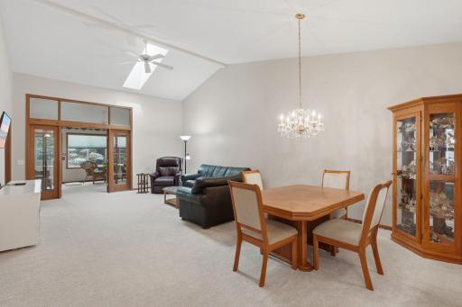 Skylight, chandelier & newer carpet in the Living Room/Dining Room