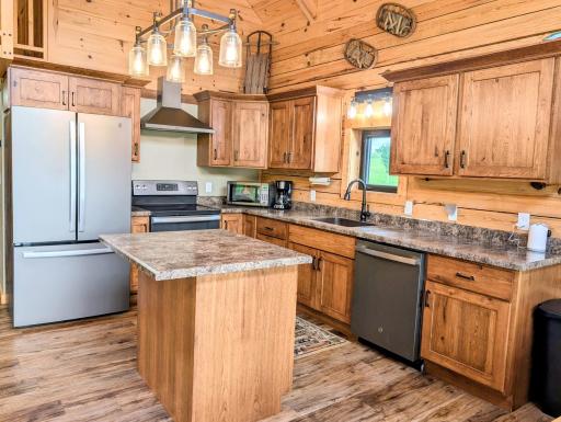 Kitchen with black stainless steel appliances
