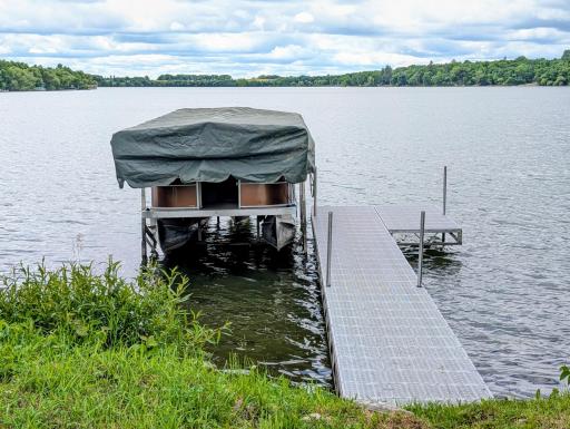 150 feet of Lake Latimer lakeshore. Dock stays.