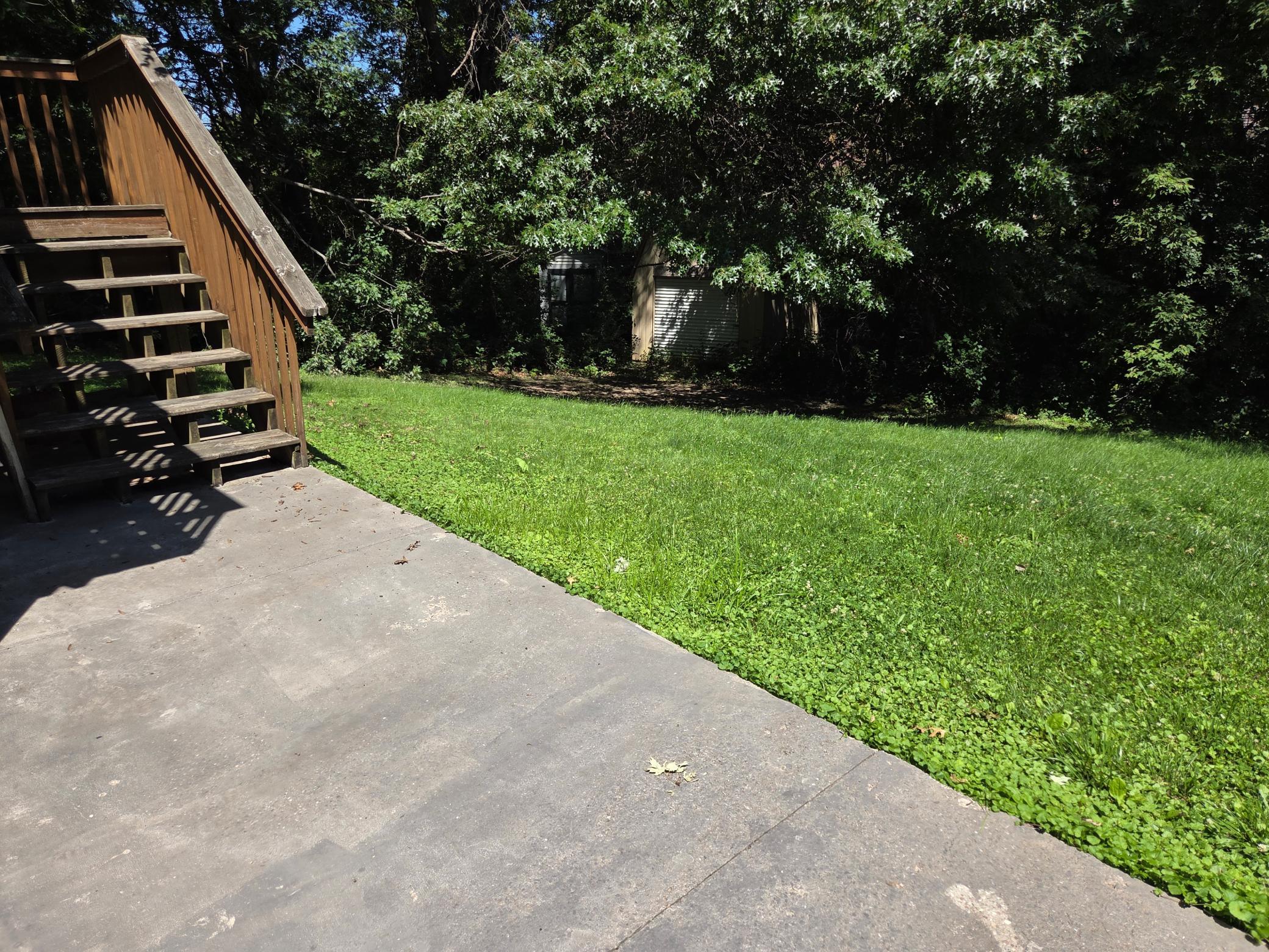 And hidden BONUS - little barn with garage door tucked in the back NW corner of lot - nice!