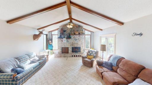 Living room w/vltd ceiling and cozy frplc