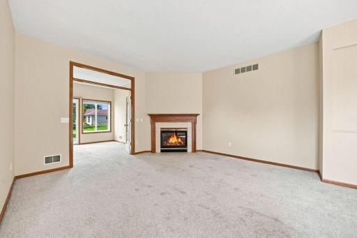 Glass French doors open to the sunroom.