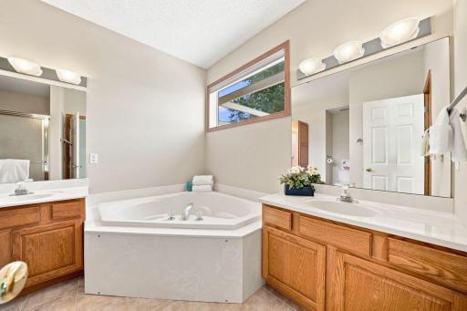 The private primary bath features double vanities & is luxurious & bright!
