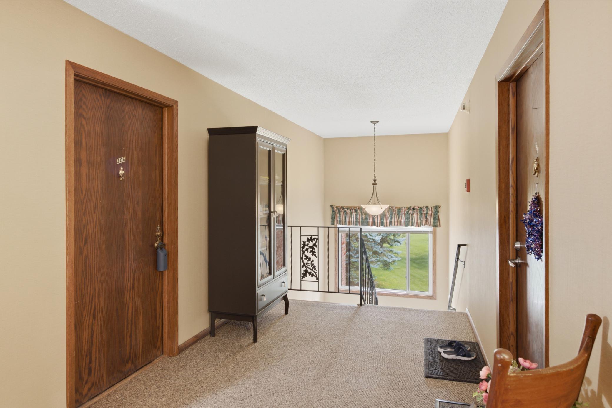 The inviting interior beckons you to the front door. It is only one and a half stories up the stairs to the 3rd floor. The first floor of the building is partially underground.