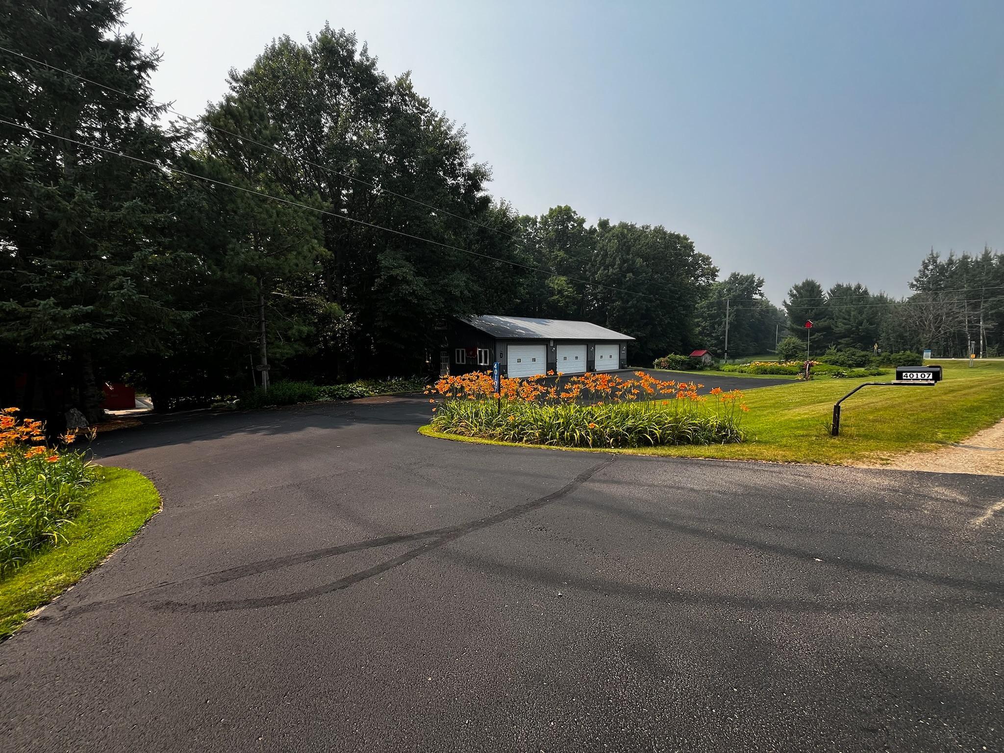 Driveway Entrance + Heated Shop Access
