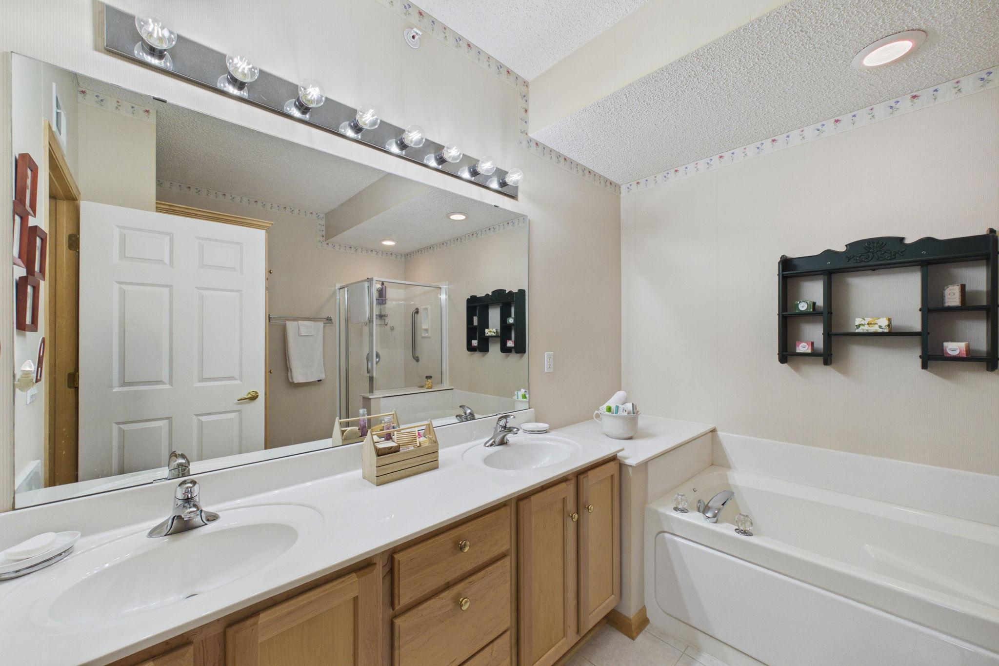 Primary bathroom with two sink vanity and tons of space