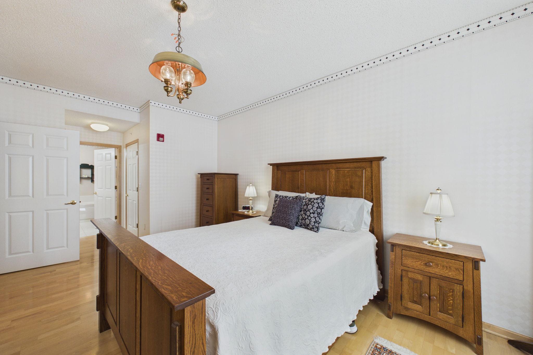 Primary bedroom with access to bathroom and walk in closet