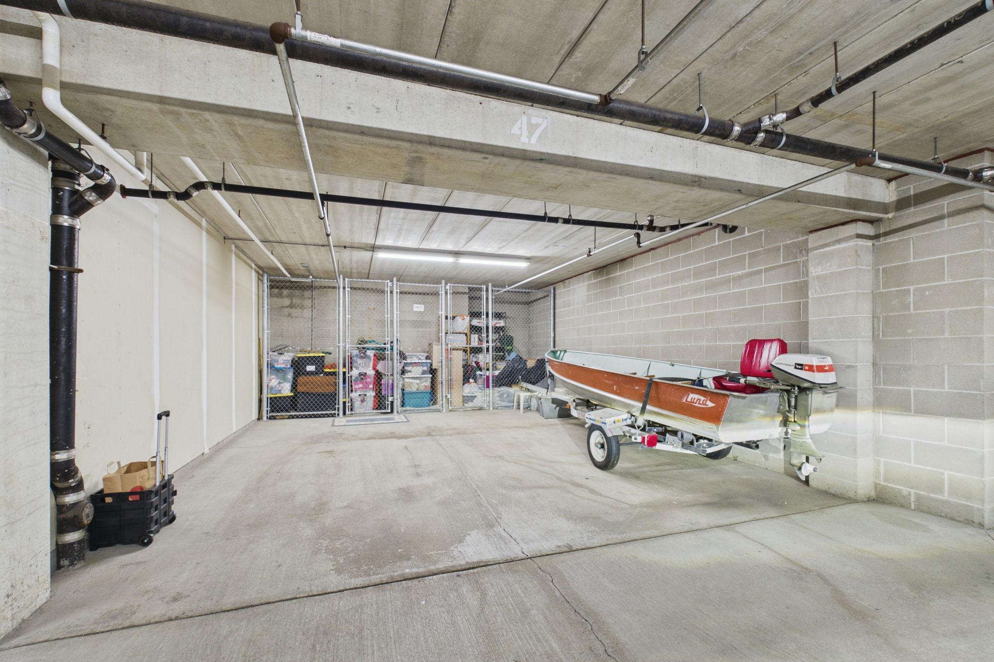 two car stall garage spaces with locked storage gage