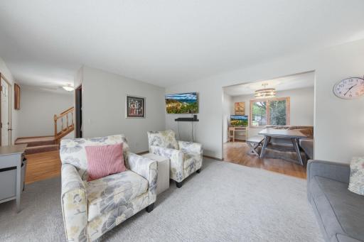 Living is open to front entrance and to dining room.