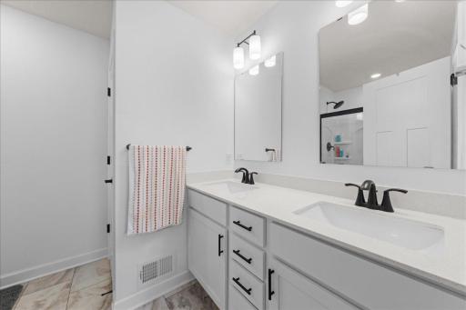Double vanity in primary bedroom bathroom.