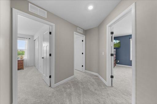 Upper level hallway leading to 3 bedrooms on this level.