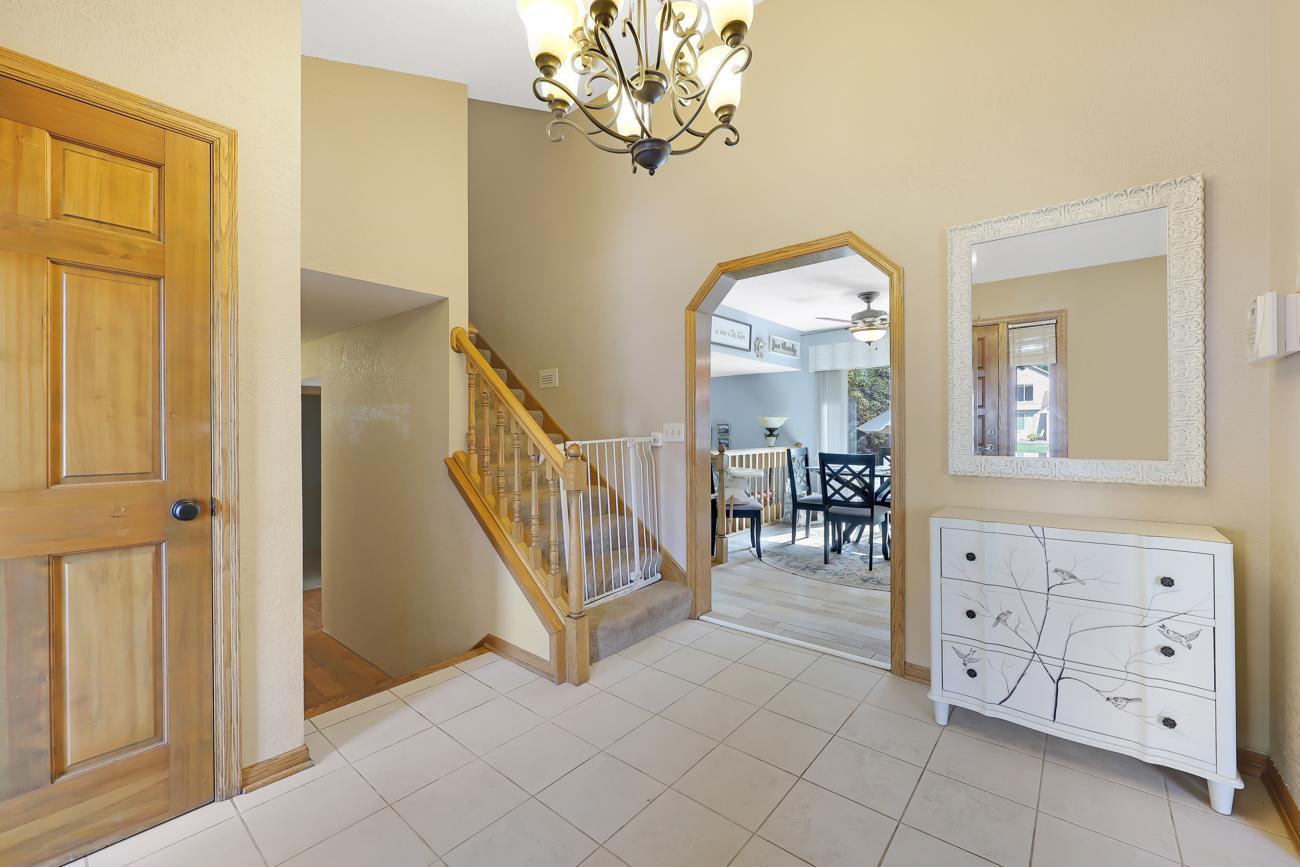 Bright, vaulted foyer; solid doors
