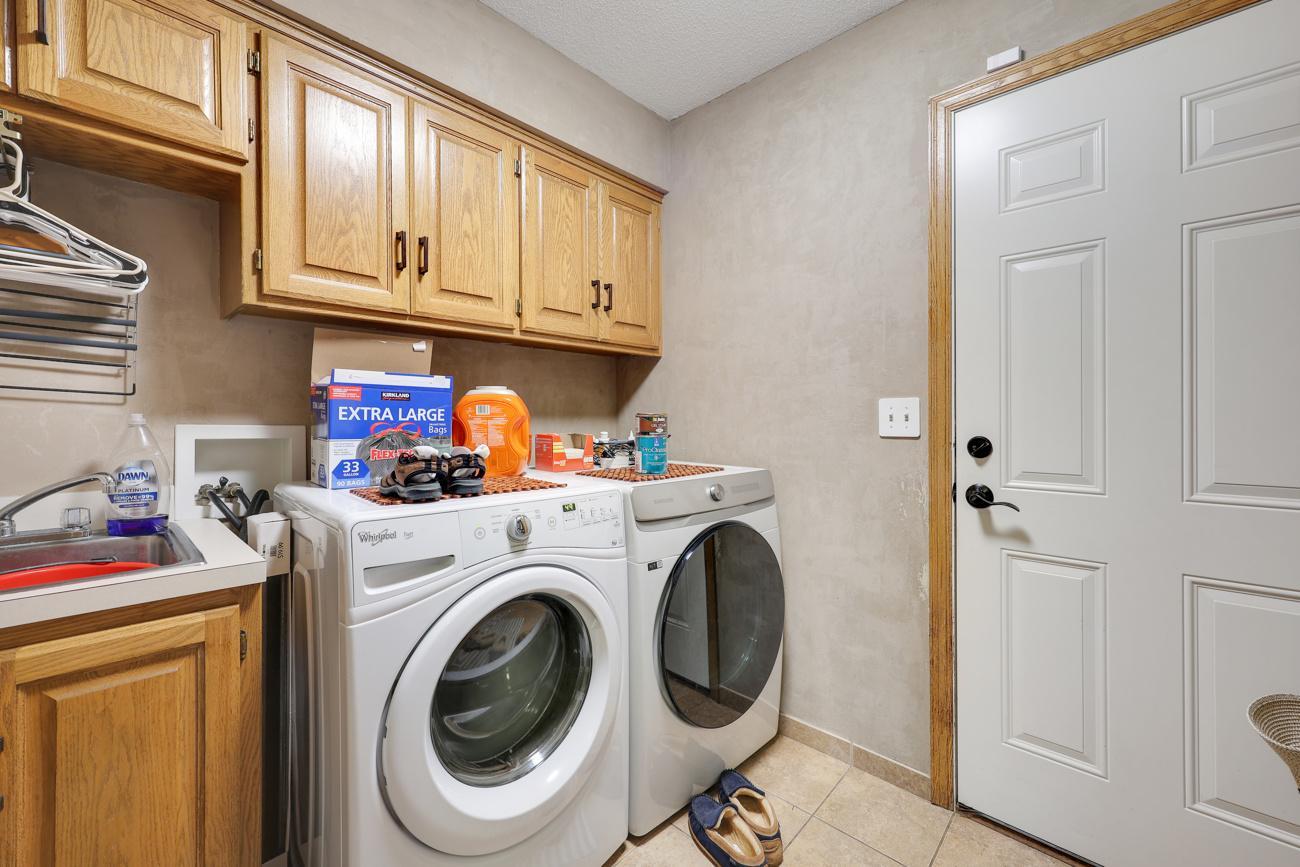 Main floor laundry, adjacent to garage entrance - nice!