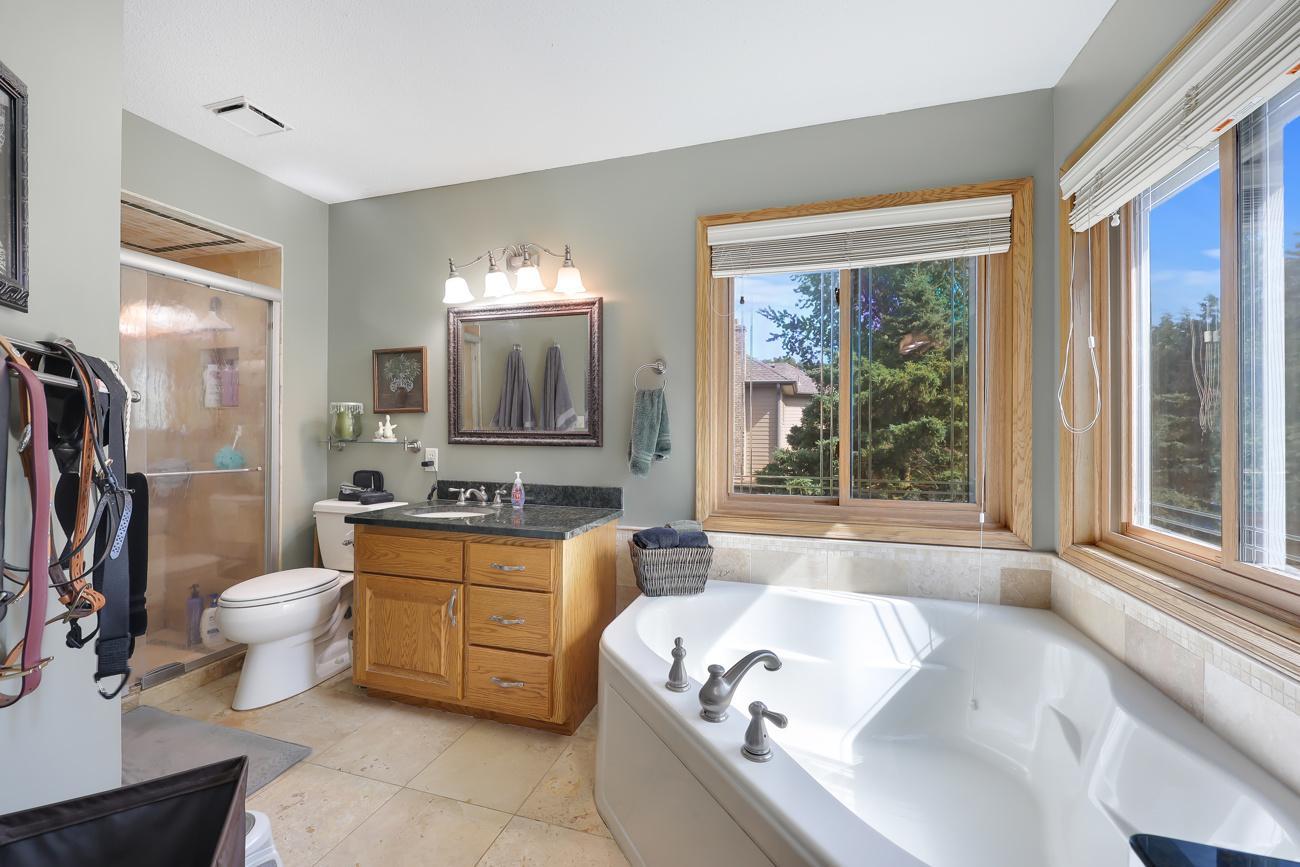 Updated bath with separate shower & relaxing corner tub