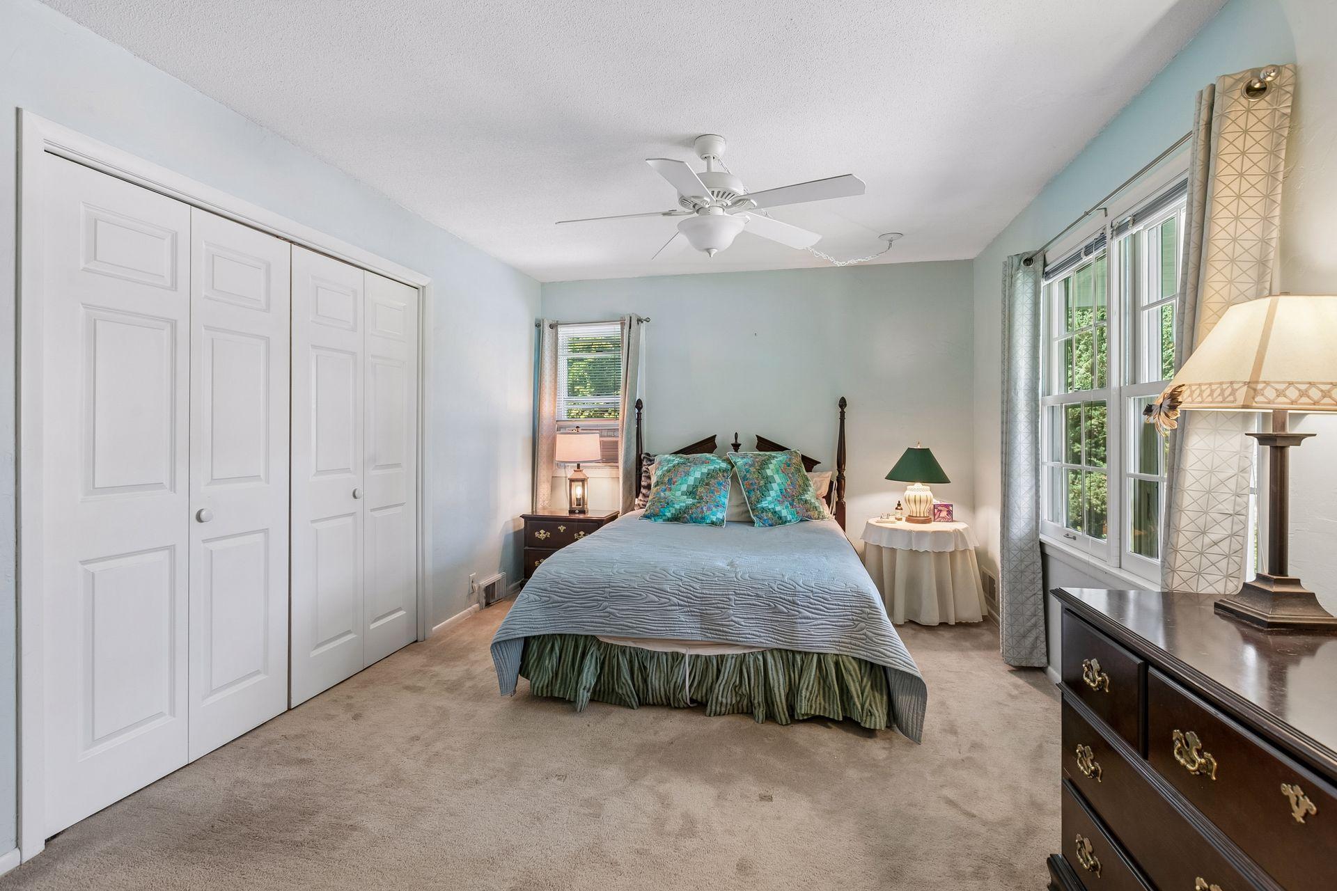 Primary bedroom has a wall of closets and plenty of room