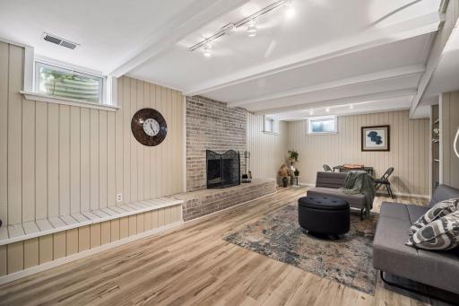 Enjoy cozy winter game nights in this updated lower levell family room