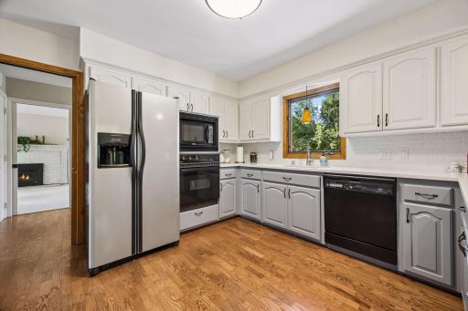 The kitchen window overlooks the expansive back yard