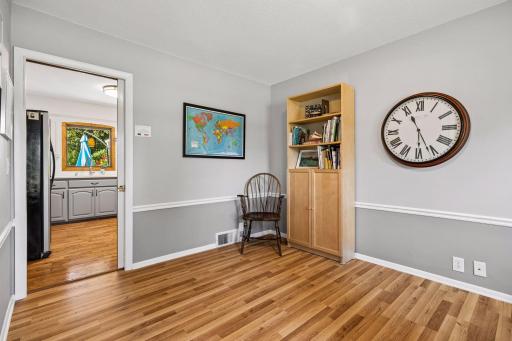 Just off the main entrance is this wonderful flex room presently being used as an at home office