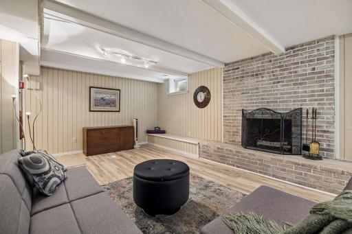 You'll love the warmth of the lower level wood-burning fireplace!