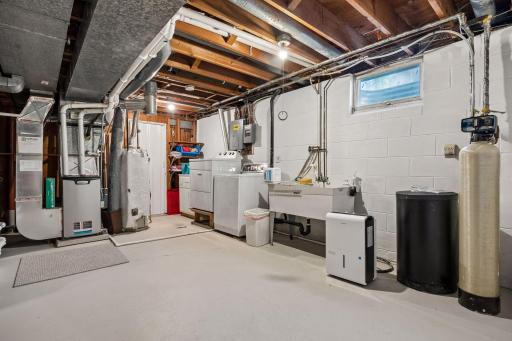 The laundry area has updated washer and dryer and a large utility sink making laundry a breeze!