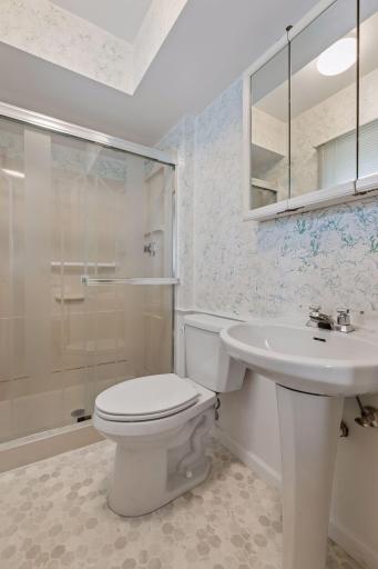Private ensuite bath in primary bedroom.