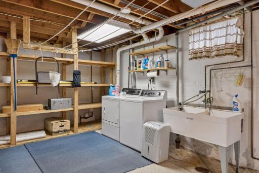 Built-in storage shelves in the laundry room.