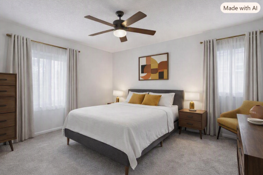Primary bedroom offers ensuite bathroom with shower- virtually staged