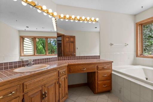 Primary bath offers Vanity space and Jetted tub