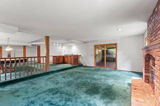Entertainers Dream space! Wet Bar, Pool table, fireplace and walk out to the patio!