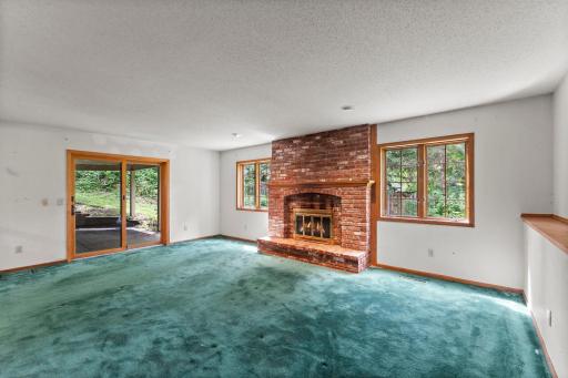 The Wood Burning Brick fireplace is the second fireplace in this grand home
