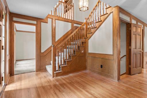 Open and grand staircase to upper level loft and bedrooms