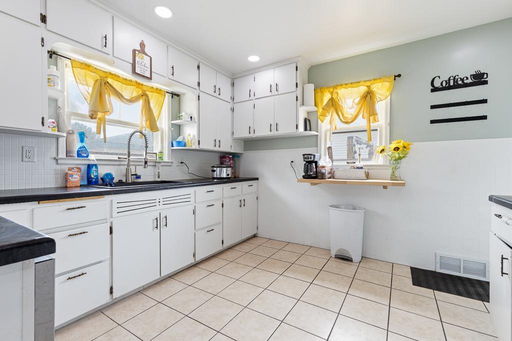 The kitchen is in the back of the home with access to the patio and steps away from the detached garage