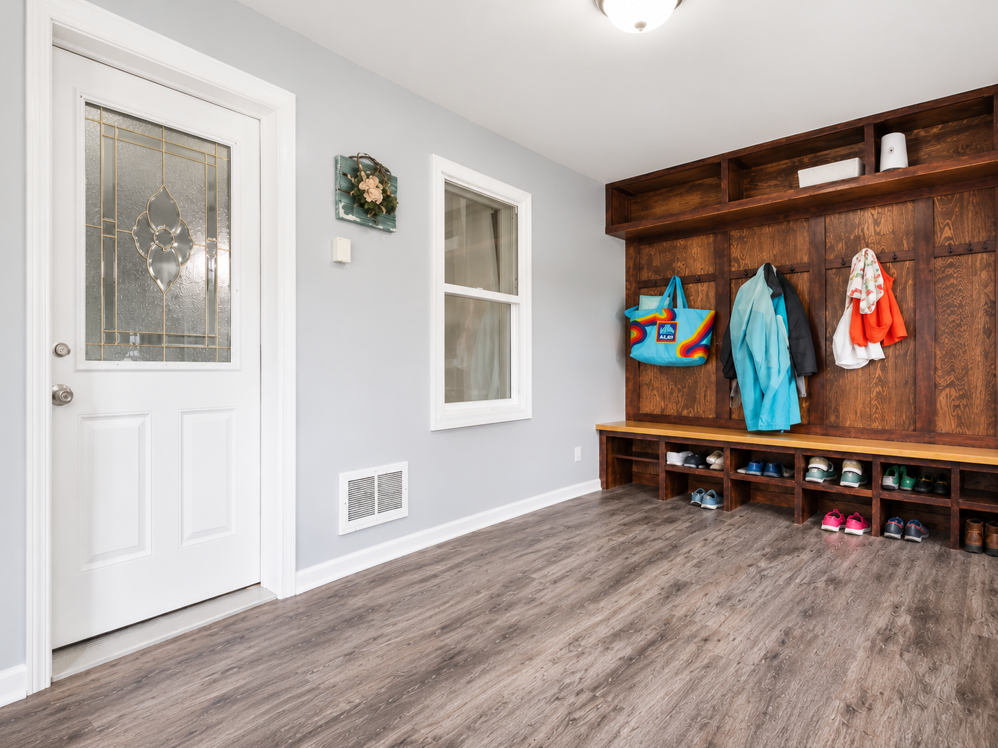 Built-in seating/storage to tuck away shoes and outdoorwear