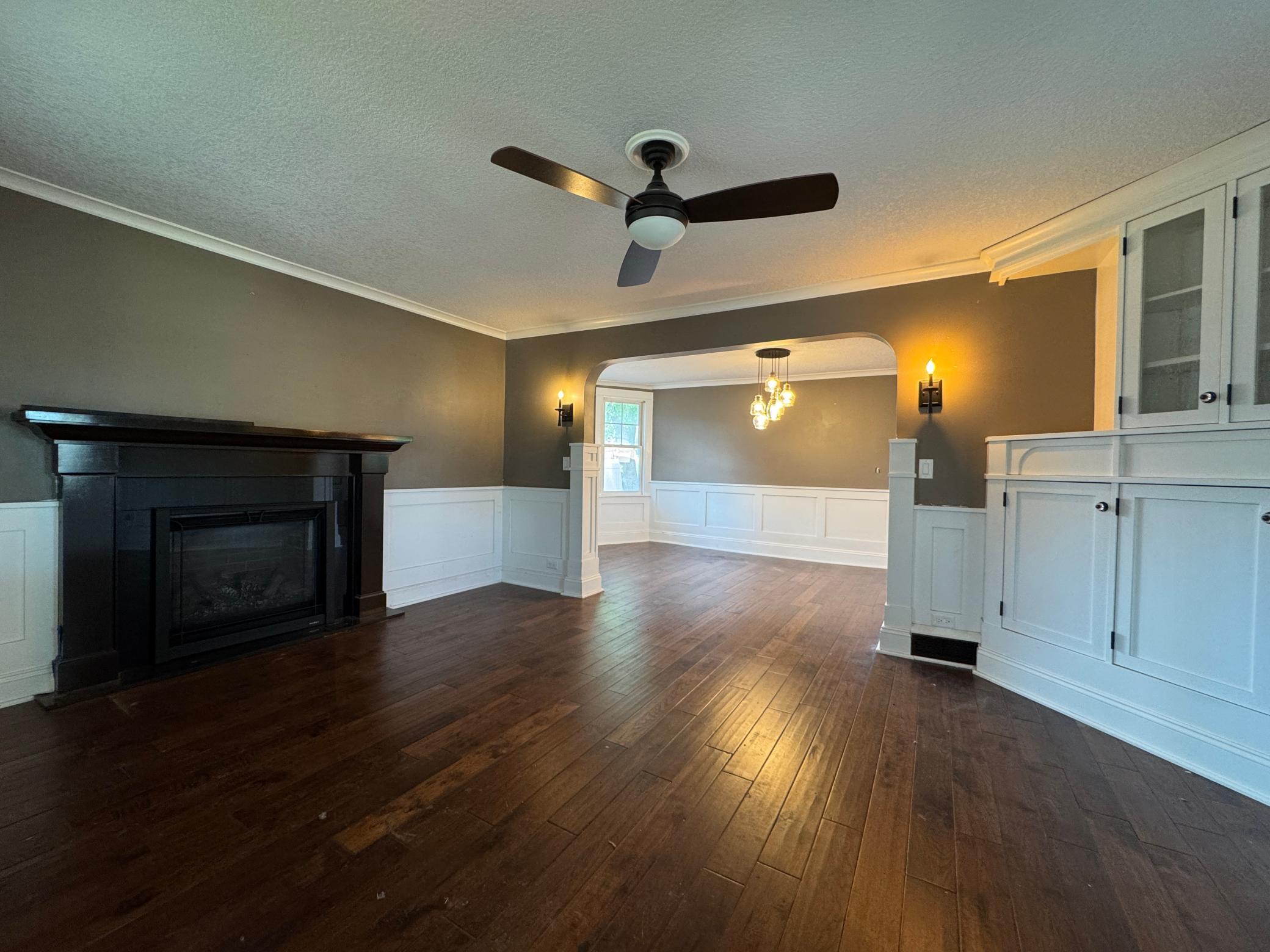 Gas fireplace, built ins and orignal Craftsman arch in the design