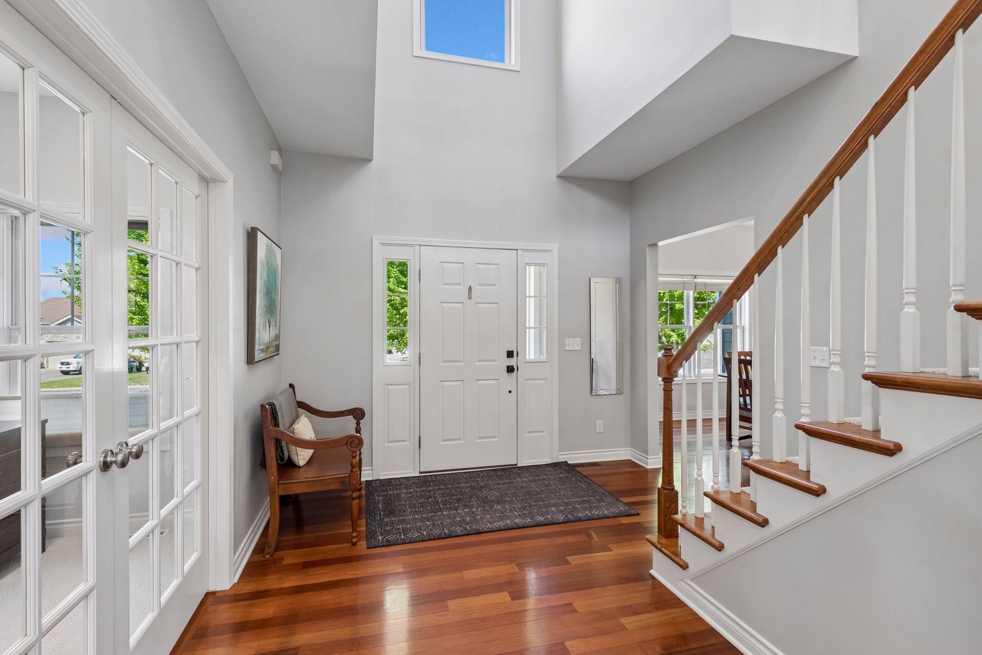 Solid wood floors and a 2-story foyer greet you as you enter the home