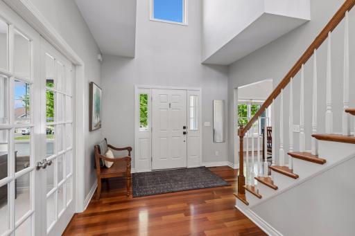 Solid wood floors and a 2-story foyer greet you as you enter the home