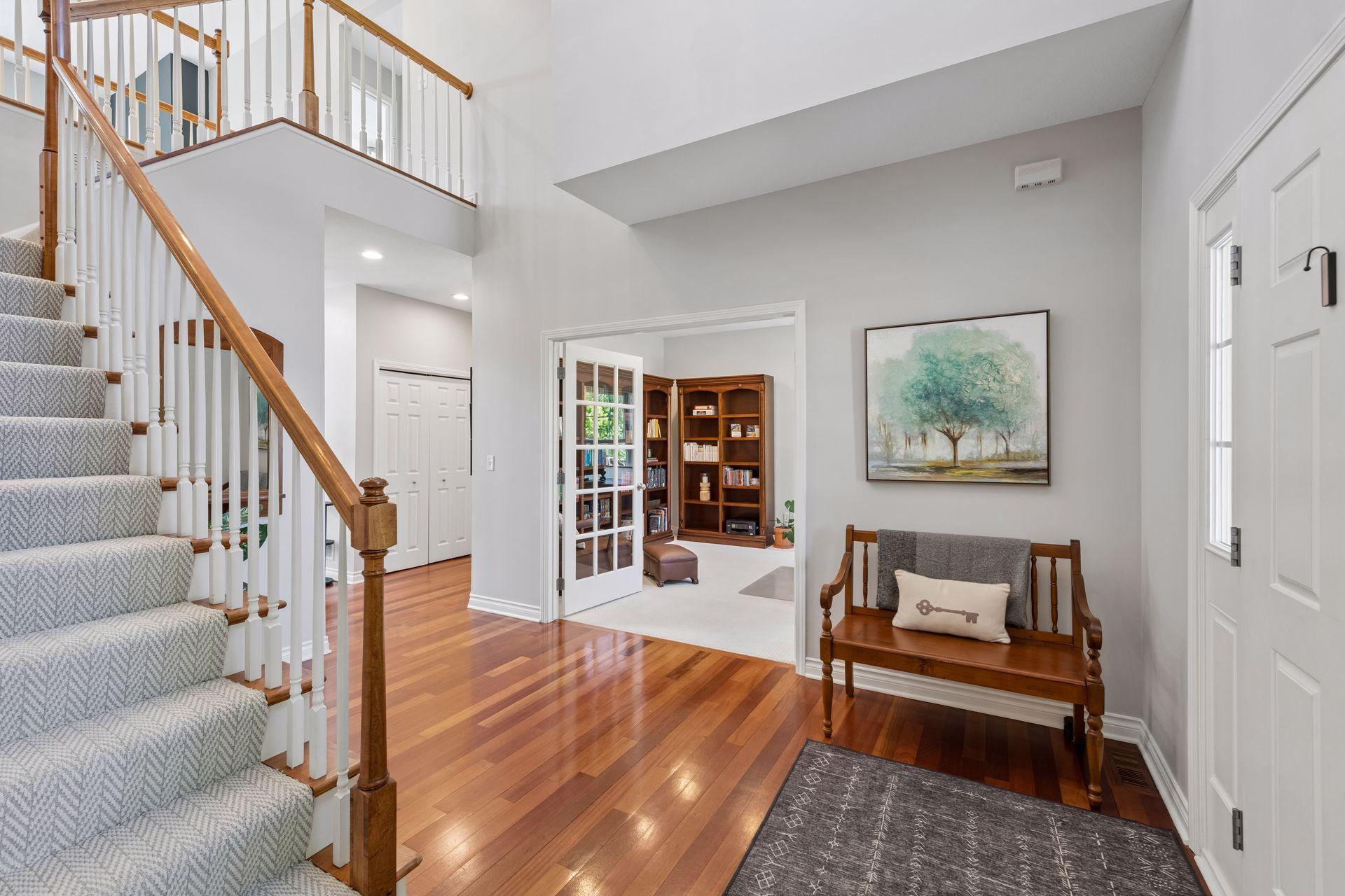 Just off the main foyer are glass FrJut off the main foyer are glass French doors leading the den/office