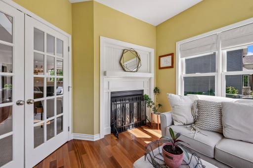 The pass through fireplace connects to the light-filled sitting room!
