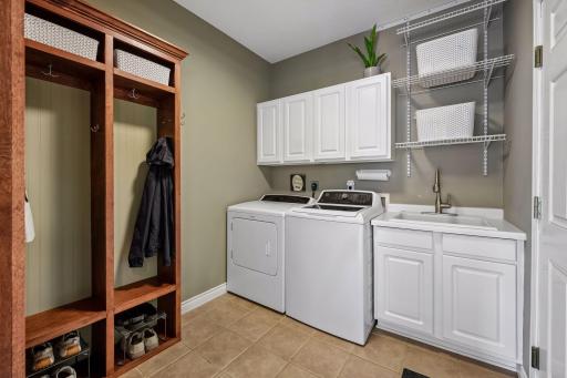 Just off the kitchen is a full laundry area with sink plus the perfect spot for the mudroom complete with build in 'locker' space
