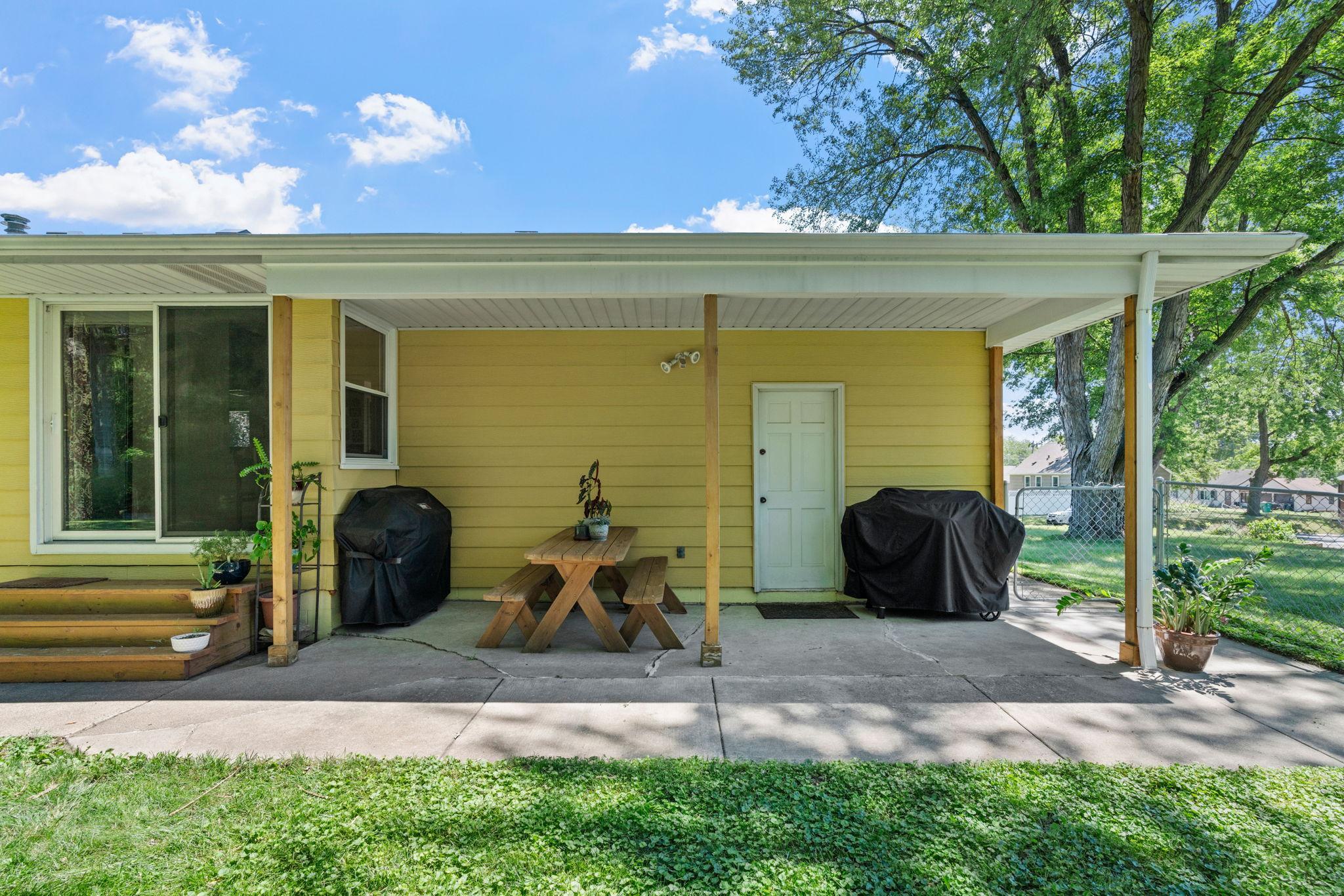 Covered patio with access to the kitchen & garage