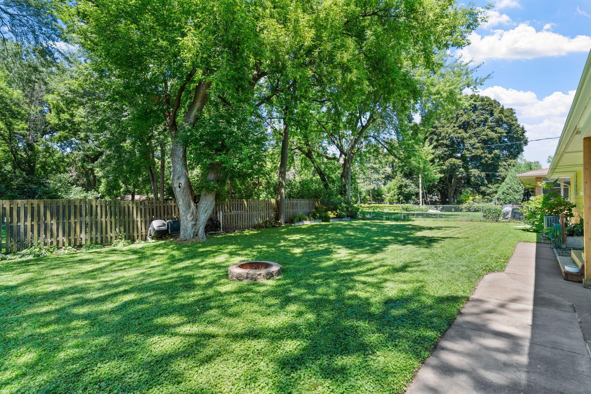 Large & flat fenced in backyard