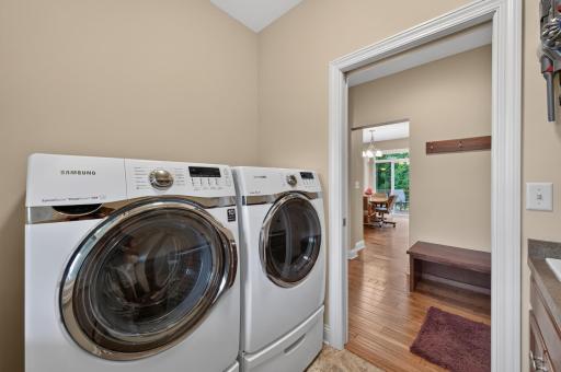 Everyday tasks become a little easier with this thoughtfully designed laundry room, ideally situated alongside the home's drop zone to keep life organized from the moment you walk in the door.
