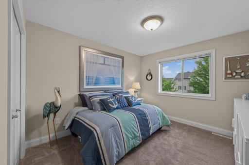 Comfortable, bright, and beautifully proportioned, this 2nd bedroom on the upper level offers a peaceful place to recharge while providing plenty of space to suite a variety of needs.